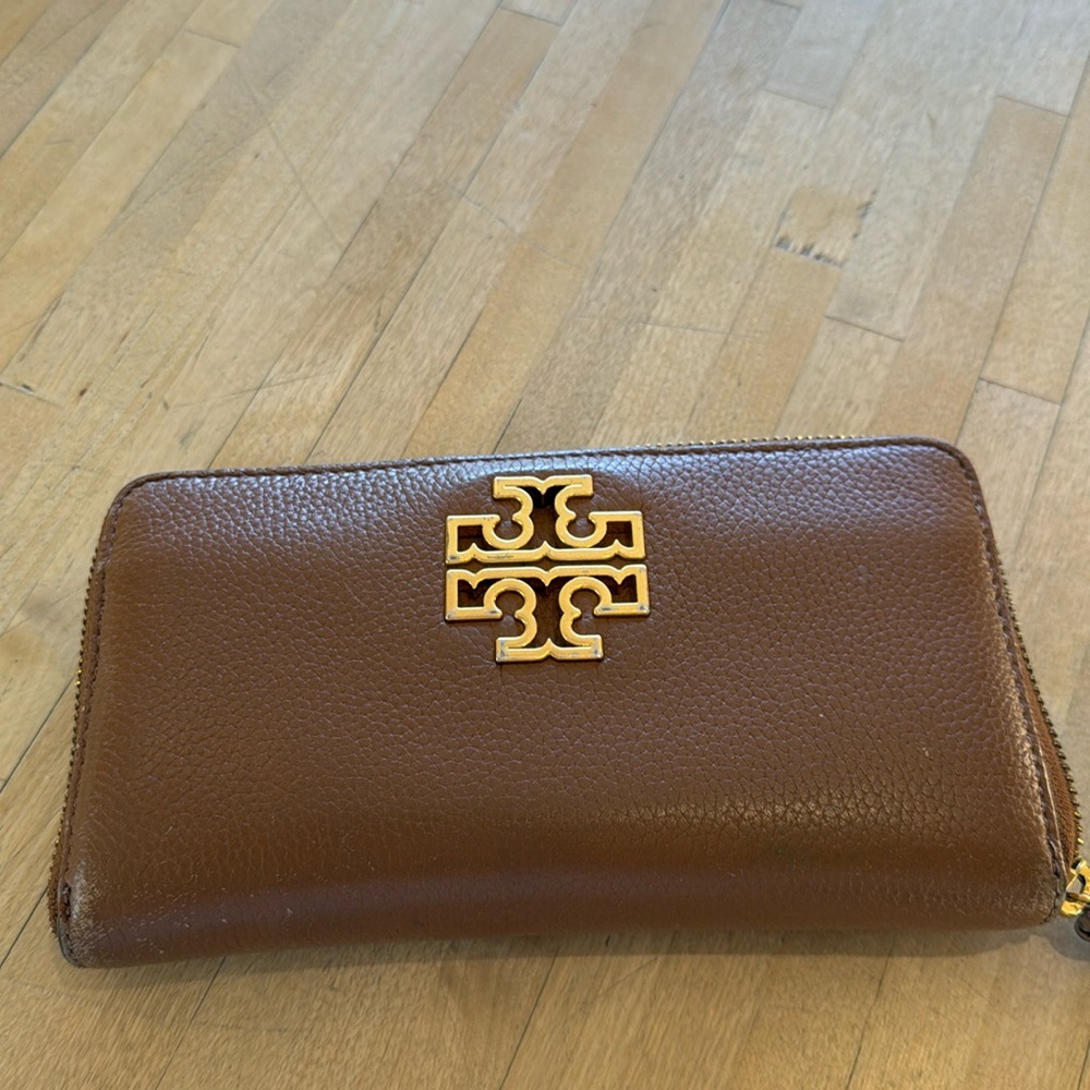 Tory Burch tan leather wallet.